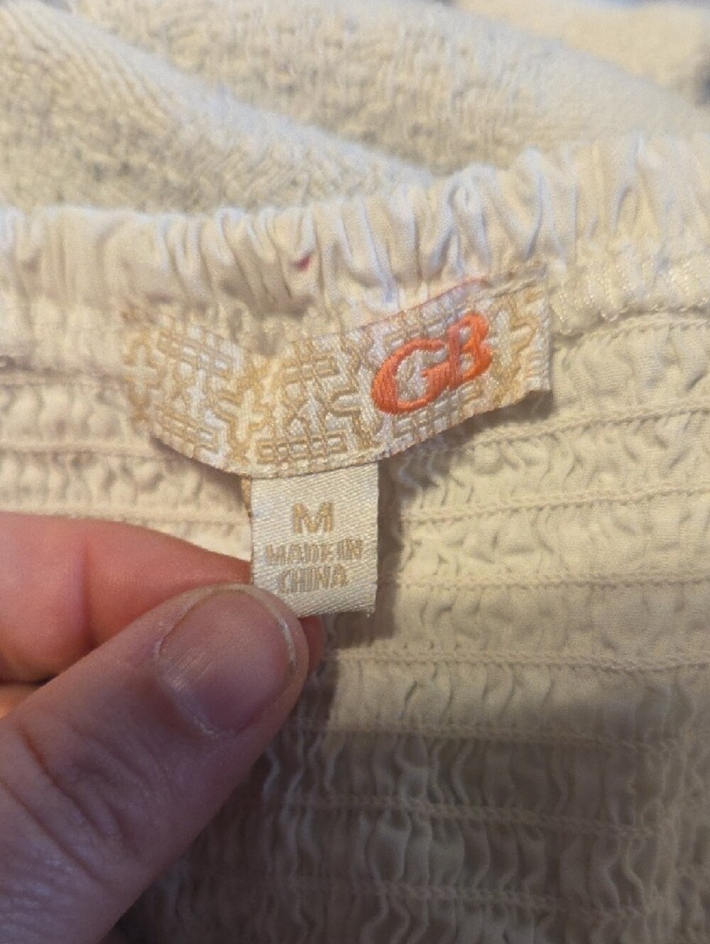 Gianni Bini White Smocked Blouse with Subtle Orange Logo - Picture 3 of 3